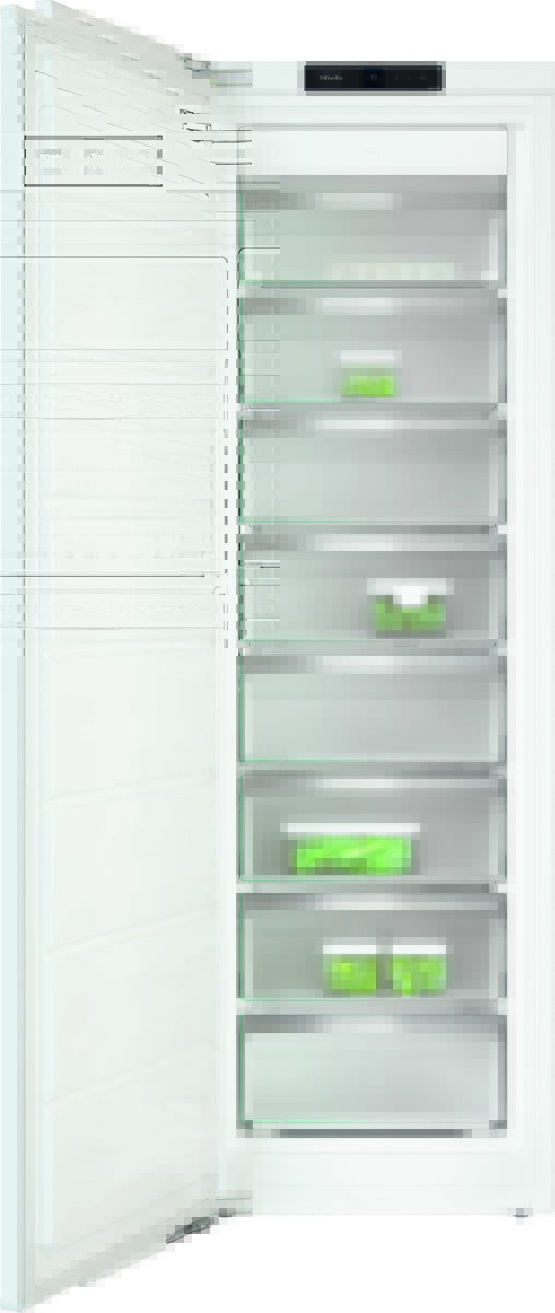 Open tall white freezer with multiple pull-out drawers; some green packaged items are visible inside the drawers.