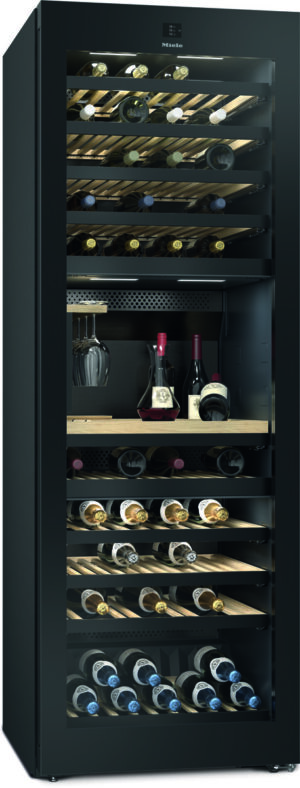 Tall black wine cooler with a glass door, filled with wine bottles on wooden shelves and a few decanters on a lower rack.