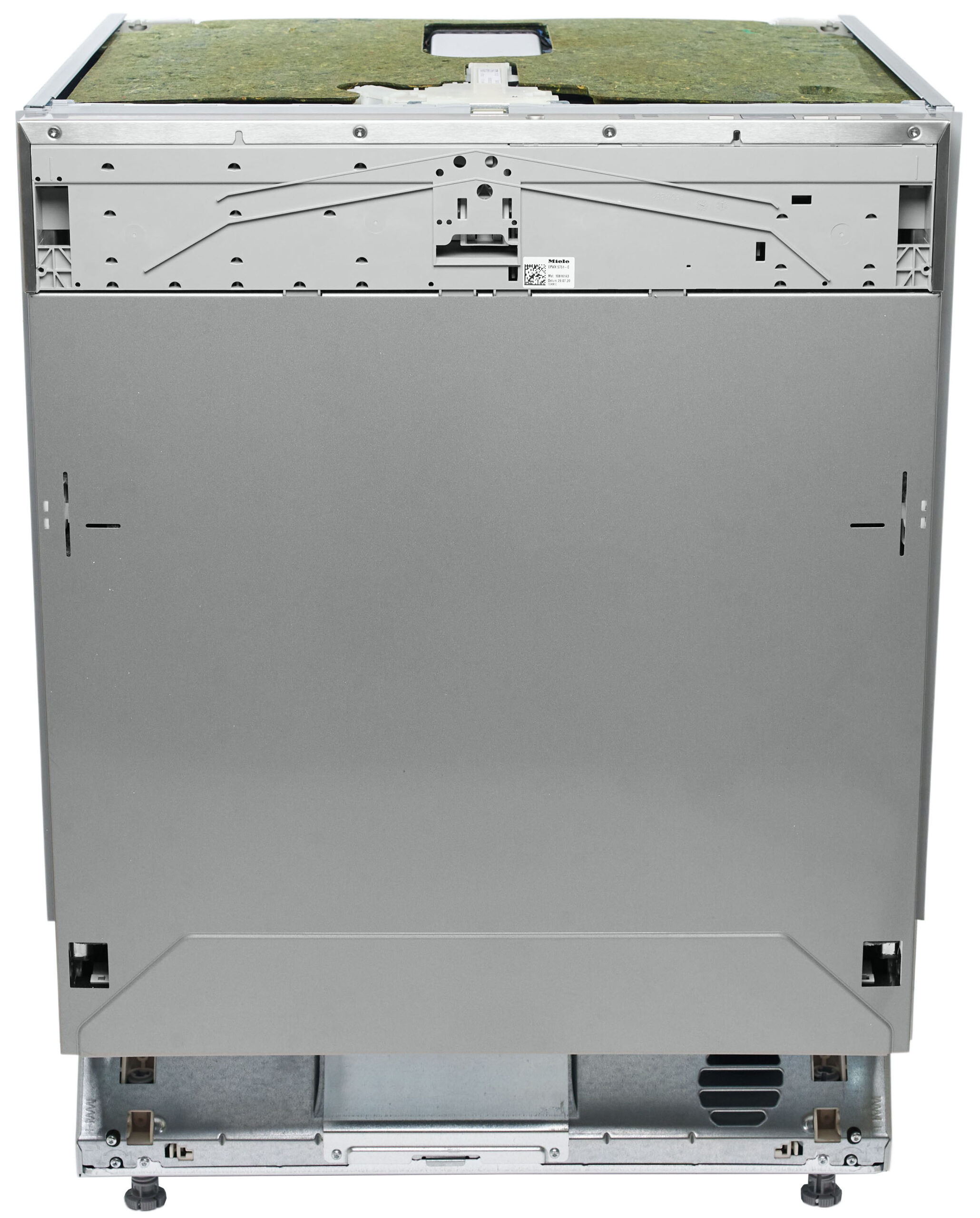 Rear view of a large gray metal appliance with a vented back panel, visible screws, and adjustable feet at the bottom. A green insulation panel sits on top.