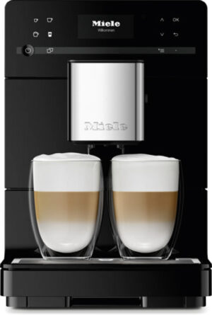 Miele coffee machine dispensing two latte macchiatos into glass cups