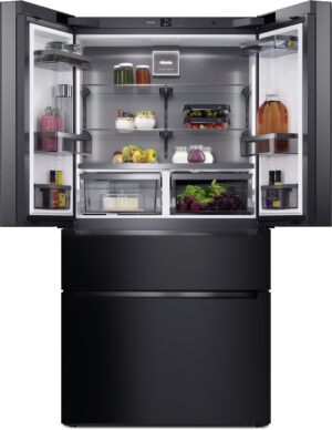 Open stainless steel refrigerator with glass shelves, showing fruits, vegetables, jars, and beverages.