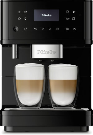 Black Miele coffee machine dispensing two cappuccinos into glass cups with foamy tops.