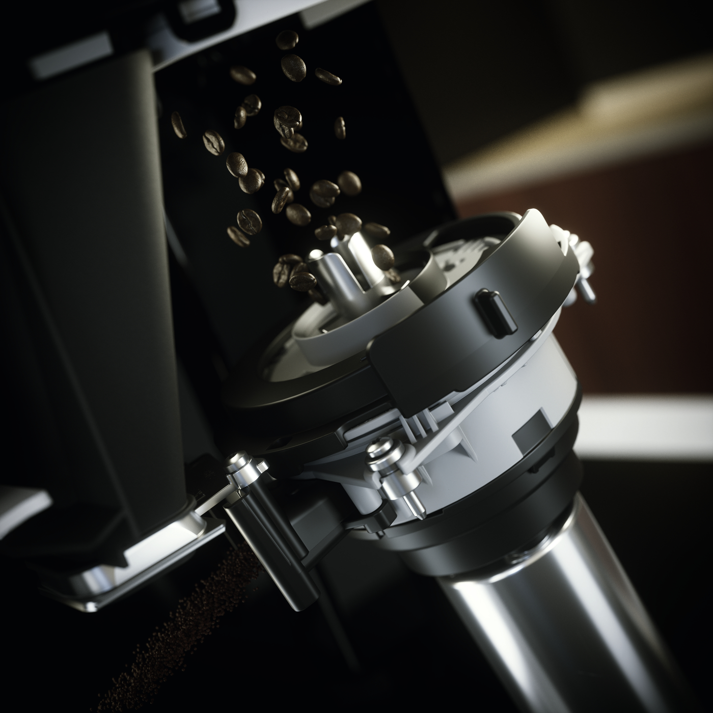 Roasted coffee beans falling into a metal espresso grinder/chamber.