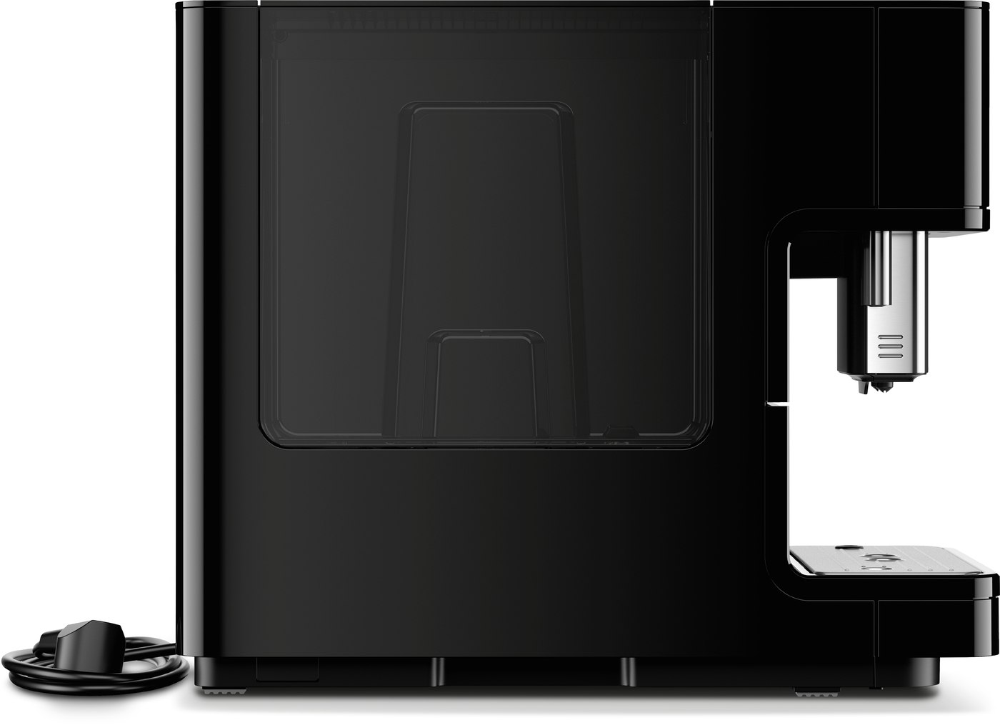 Side view of a black espresso machine with a metal drip tray and power cord coiled on the left edge
