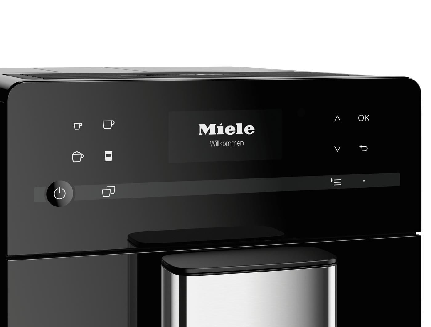 Miele appliance control panel with a central display saying 'Miele Willkommen' and touch icons (cups, power) on a black glossy surface.