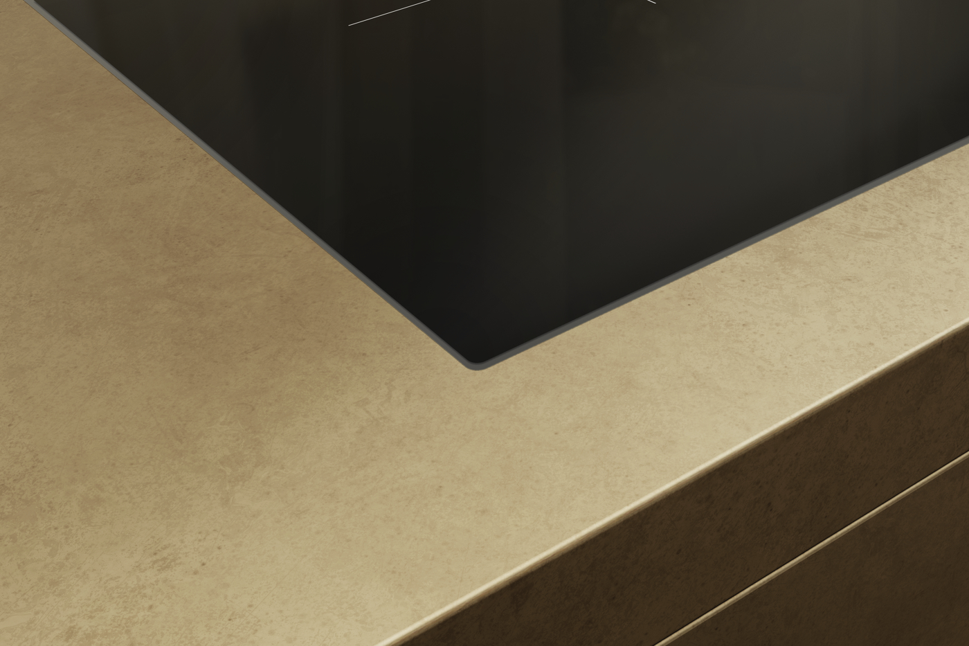 Close-up of a black laptop corner resting on a beige textured countertop/desk.